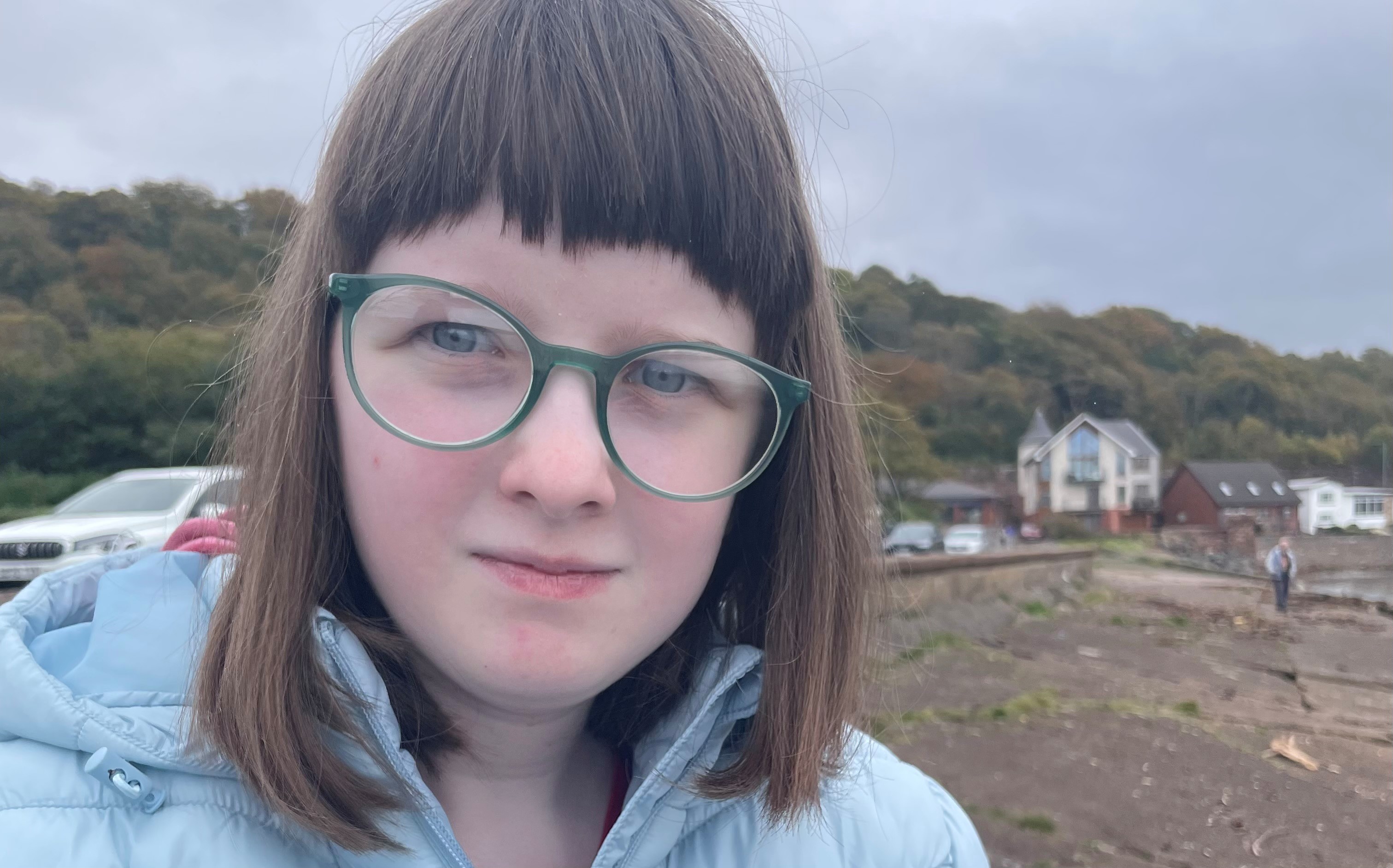 A young girl looks at the camera.