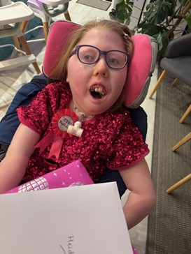 A little girl with a birthday gift