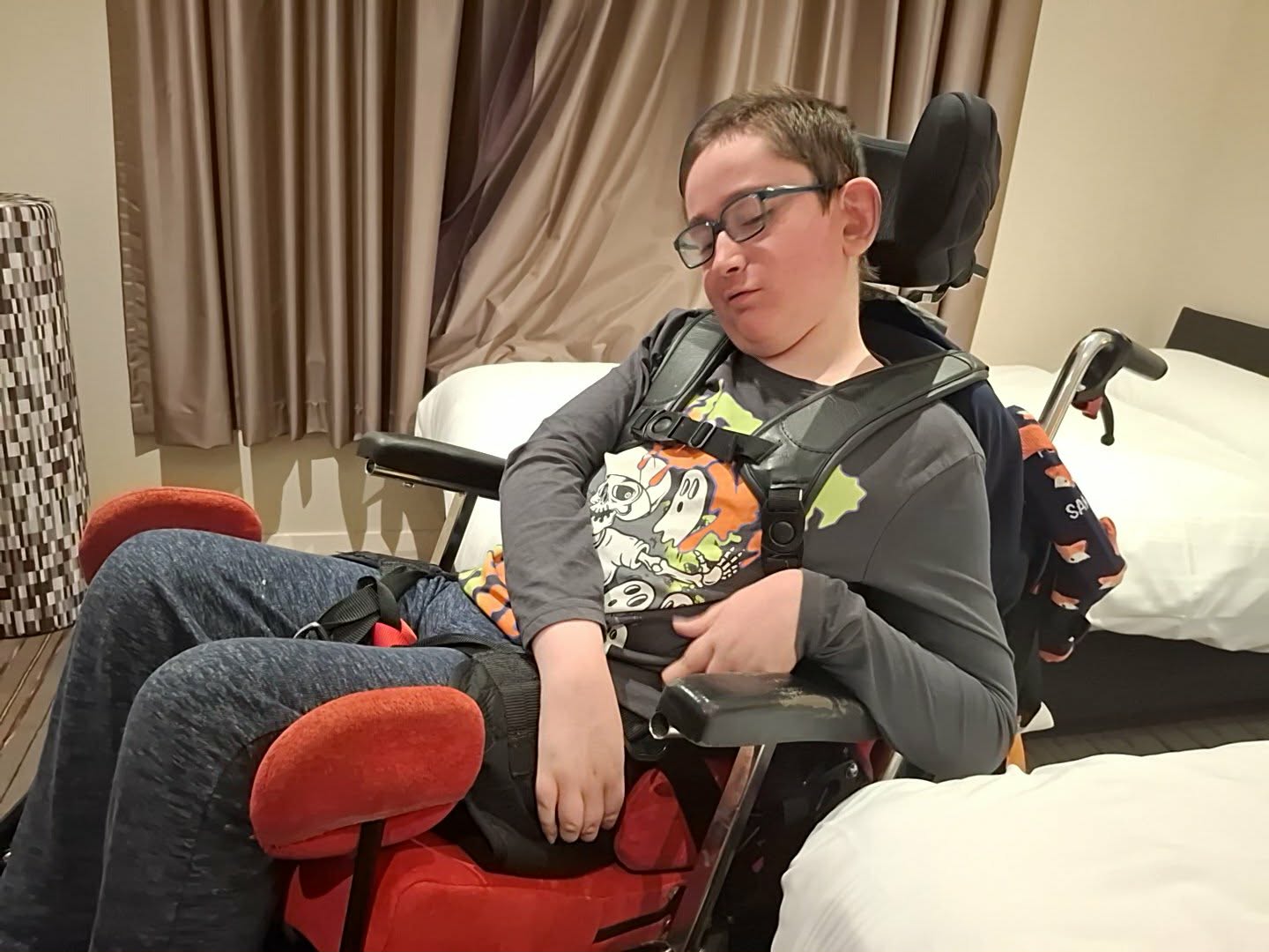 A young man in a wheelchair