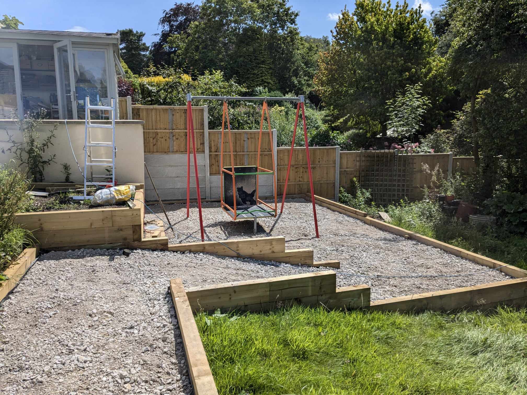 An accessible swing set in a home garden.