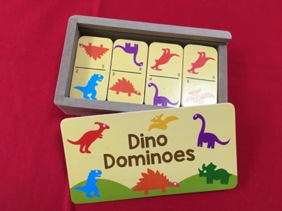 Wooden dominoes with painted dinosaurs on them