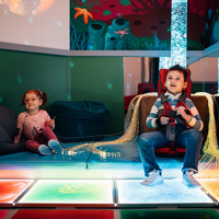 Child using GoTo at an experiential exhibit playing games