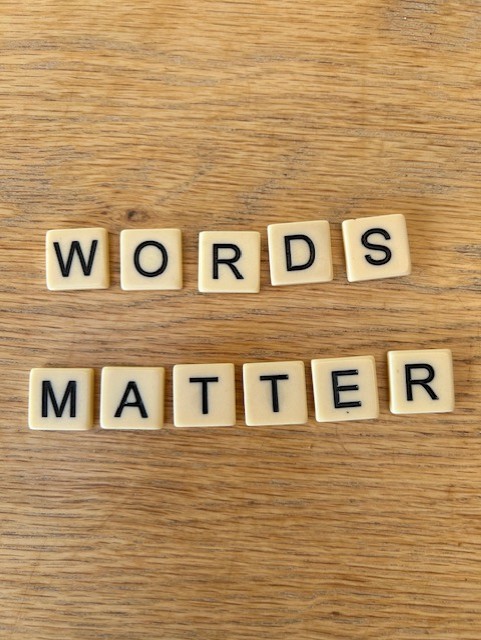 Scrabble pieces reveal the phrase 'words matter'